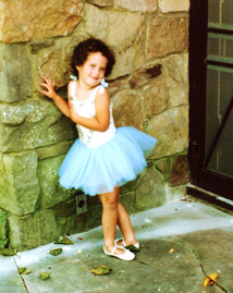 The author at age 5, in dancing dress.